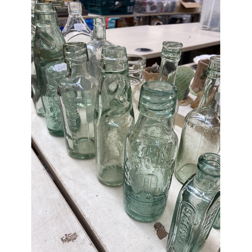 393 - Twenty vintage glass bottles