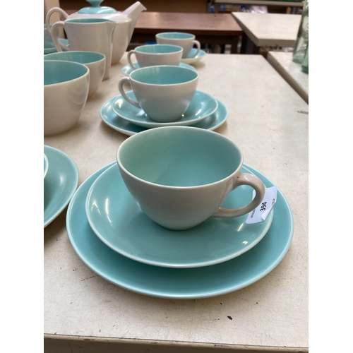 394 - A collection of Poole Pottery Twintone dinnerware