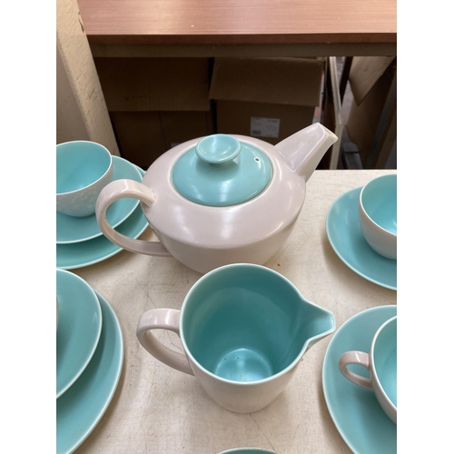 394 - A collection of Poole Pottery Twintone dinnerware