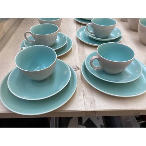 394 - A collection of Poole Pottery Twintone dinnerware