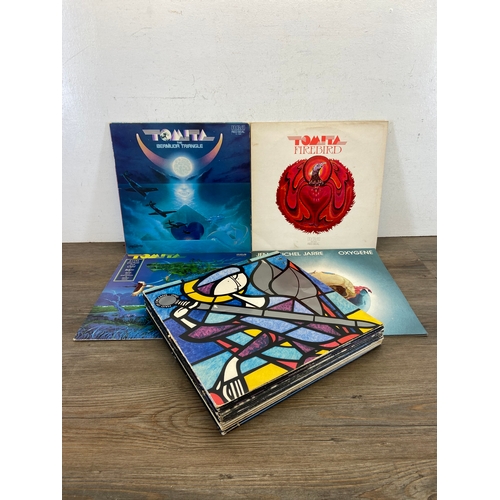 710 - Fifteen LP vinyl records by a variety of artists and bands to include OMD, Peter Gabriel, Alabama, L... 