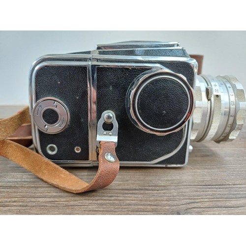 594 - A cased 1970s Arsenal Zenith 80 6x6 medium format SLR camera for 120 film with spare film back - mad... 