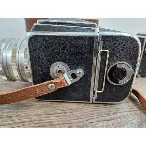 594 - A cased 1970s Arsenal Zenith 80 6x6 medium format SLR camera for 120 film with spare film back - mad... 