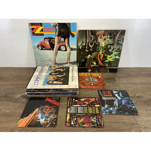 716 - Twenty-three vinyl records by a variety of artists and bands to include Greenslade, Guns N' Roses, J... 