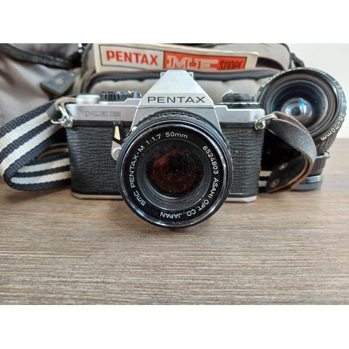 598 - Four Pentax 35mm SLR cameras, two ME Super fitted with Pentax-M 1:1.7 50mm lenses and two MX