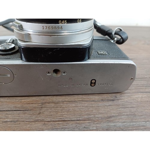 600 - An Olympus OM-1N MD 35mm SLR camera fitted with Zuiko Auto-S 1:1.8 f=50mm lens