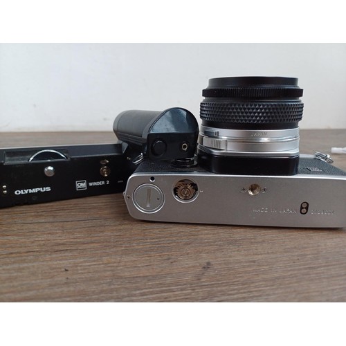 601 - An Olympus OM-1N MD 35mm SLR camera fitted with Zuiko Auto-W 1:2.8 f=28mm lens and Winder 2