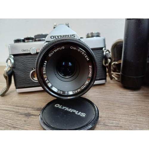 602 - Two Olympus OM-2N MD 35mm SLR cameras, one fitted with Zuiko Auto-S 1:1.8 50mm lens and Winder 2 and... 