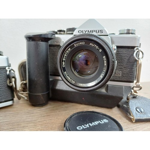 602 - Two Olympus OM-2N MD 35mm SLR cameras, one fitted with Zuiko Auto-S 1:1.8 50mm lens and Winder 2 and... 