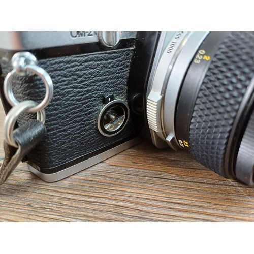 602 - Two Olympus OM-2N MD 35mm SLR cameras, one fitted with Zuiko Auto-S 1:1.8 50mm lens and Winder 2 and... 