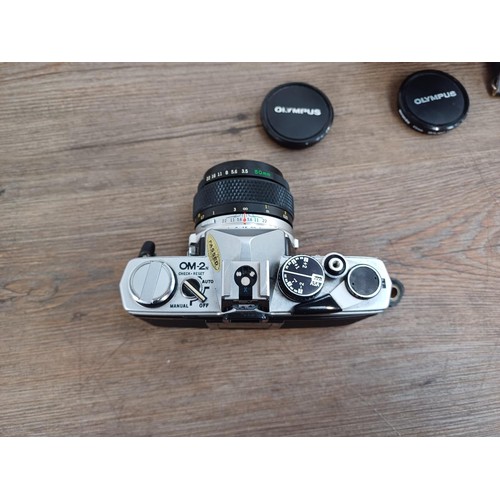 602 - Two Olympus OM-2N MD 35mm SLR cameras, one fitted with Zuiko Auto-S 1:1.8 50mm lens and Winder 2 and... 