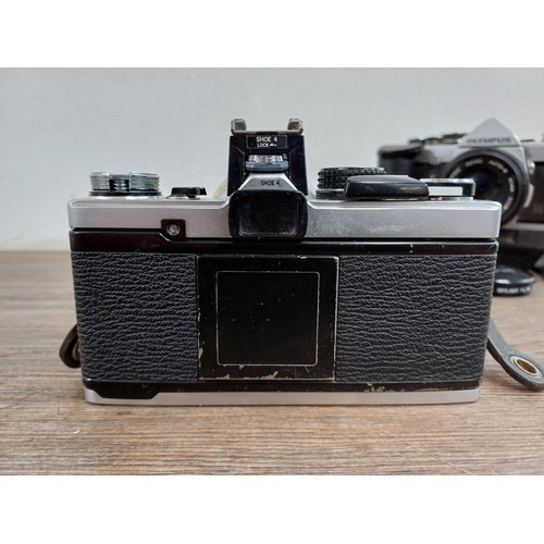 602 - Two Olympus OM-2N MD 35mm SLR cameras, one fitted with Zuiko Auto-S 1:1.8 50mm lens and Winder 2 and... 