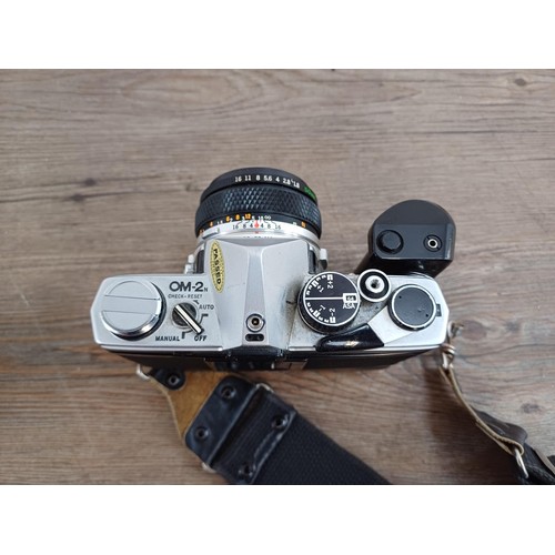 602 - Two Olympus OM-2N MD 35mm SLR cameras, one fitted with Zuiko Auto-S 1:1.8 50mm lens and Winder 2 and... 