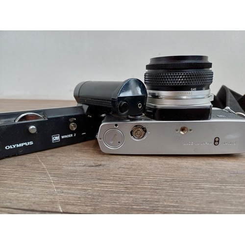 602 - Two Olympus OM-2N MD 35mm SLR cameras, one fitted with Zuiko Auto-S 1:1.8 50mm lens and Winder 2 and... 