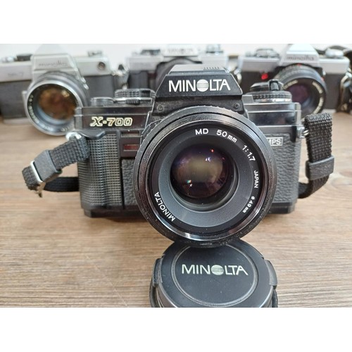 607 - Six Minolta 35mm SLR cameras fitted with Minolta lenses, X-700, SR-7 fitted with Rokkor-PF 1:1.4 f=5... 