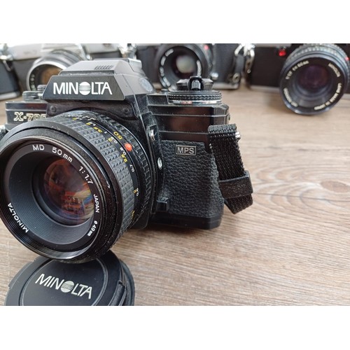 607 - Six Minolta 35mm SLR cameras fitted with Minolta lenses, X-700, SR-7 fitted with Rokkor-PF 1:1.4 f=5... 