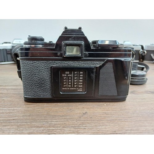 607 - Six Minolta 35mm SLR cameras fitted with Minolta lenses, X-700, SR-7 fitted with Rokkor-PF 1:1.4 f=5... 