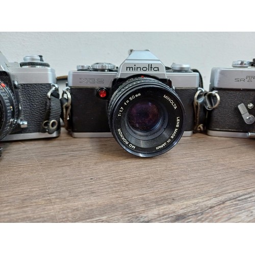 607 - Six Minolta 35mm SLR cameras fitted with Minolta lenses, X-700, SR-7 fitted with Rokkor-PF 1:1.4 f=5... 