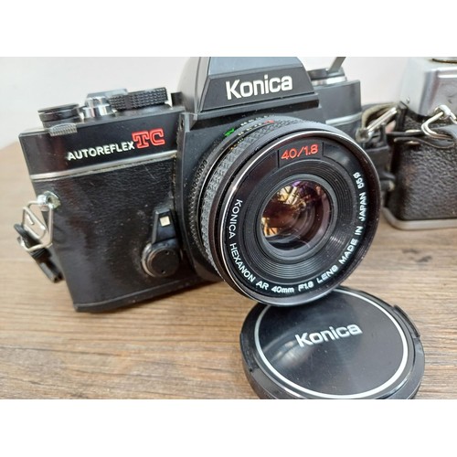 610 - Six Japanese 35mm SLR cameras, Fujica STX1, Konica Autoreflex TC fitted with F1.8 40mm lens, Cosina ... 