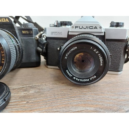 610 - Six Japanese 35mm SLR cameras, Fujica STX1, Konica Autoreflex TC fitted with F1.8 40mm lens, Cosina ... 