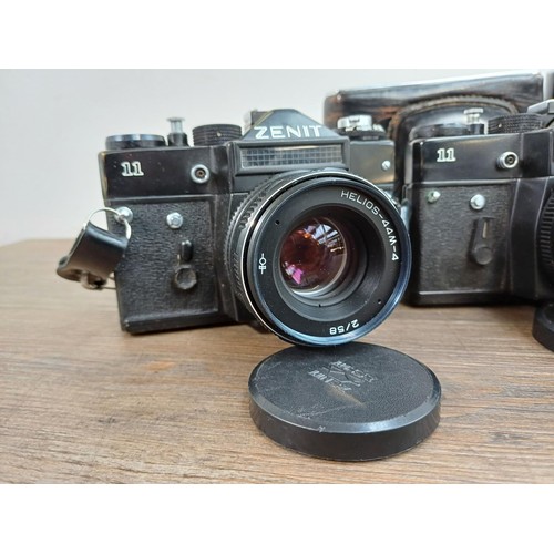 612 - Six KMZ Zenit 35mm SLR cameras, three 11 fitted with Helios-44M-4 2/58 lenses and three E fitted wit... 