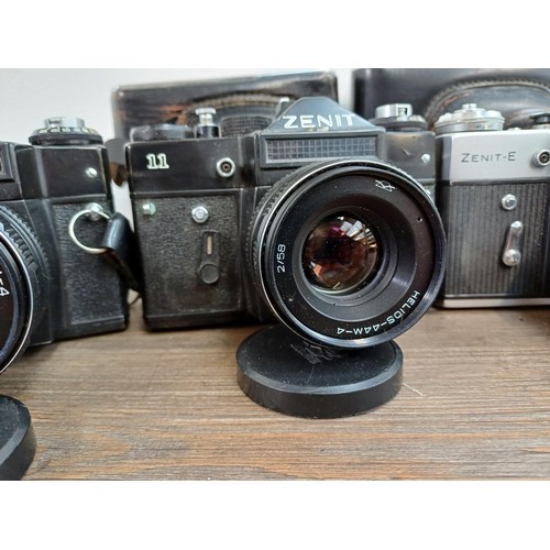 612 - Six KMZ Zenit 35mm SLR cameras, three 11 fitted with Helios-44M-4 2/58 lenses and three E fitted wit... 