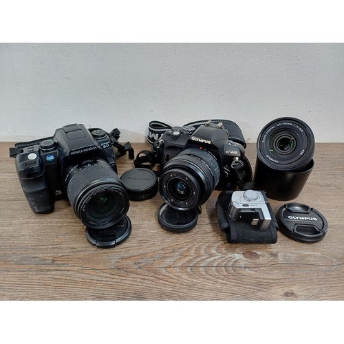 645 - Two DSLR cameras, one Konica Minolta Dynax 5D fitted with AF DT 18-70mm 1:3.5(22)-5.6 D zoom lens an... 