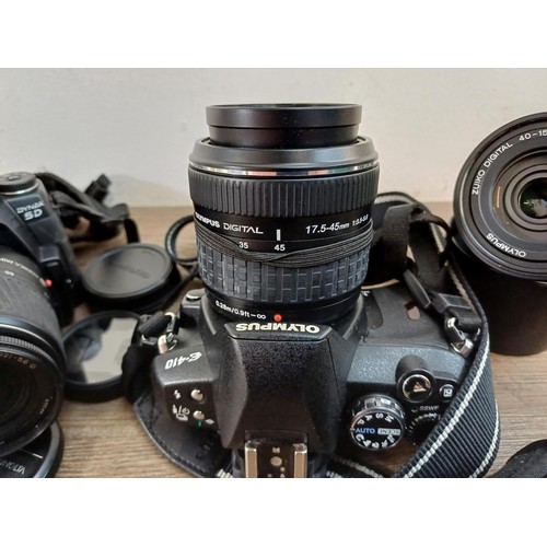 645 - Two DSLR cameras, one Konica Minolta Dynax 5D fitted with AF DT 18-70mm 1:3.5(22)-5.6 D zoom lens an... 