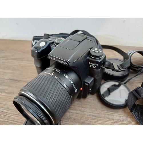 645 - Two DSLR cameras, one Konica Minolta Dynax 5D fitted with AF DT 18-70mm 1:3.5(22)-5.6 D zoom lens an... 