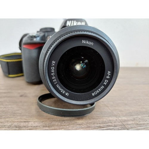 648 - A Nikon D3100 DSLR camera fitted with Nikkor AF-S DX 18-55mm 1:3.5-5.6G VR lens