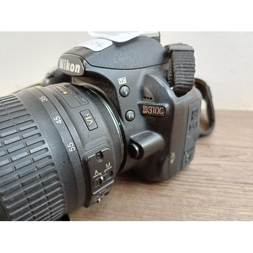 648 - A Nikon D3100 DSLR camera fitted with Nikkor AF-S DX 18-55mm 1:3.5-5.6G VR lens