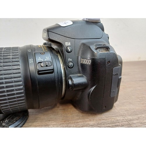 649 - A Nikon D3000 DSLR camera fitted with Nikkor AF-S DX ED 18-55mm 1:3.5-5.6G II lens