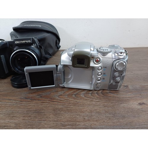 654 - Three digital bridge cameras, one cased Olympus SP-500UZ 6mp, one Nikon Coolpix P510 16.1mp and one ... 