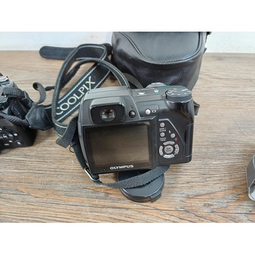 654 - Three digital bridge cameras, one cased Olympus SP-500UZ 6mp, one Nikon Coolpix P510 16.1mp and one ... 