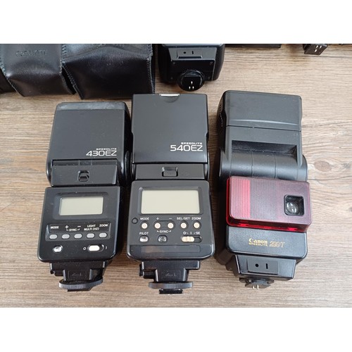 656 - Seven Canon Speedlite flashes to include two 299T, 540EZ, 430EZ etc.