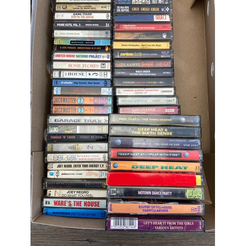 739 - Two Boxes containing CDs and cassettes by a variety of artists and bands to include Oasis, R.E.M, Bo... 