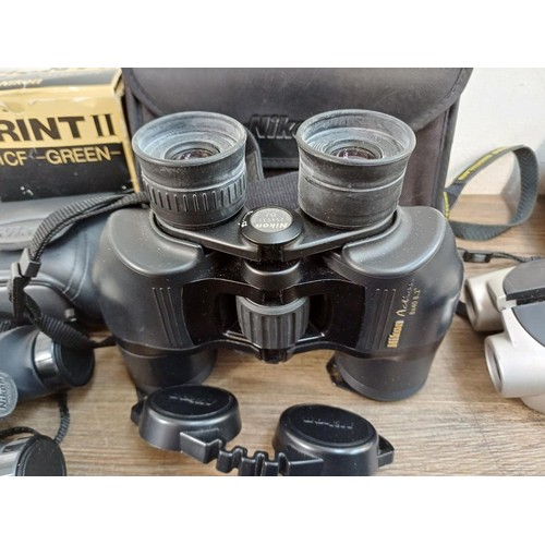 659 - Seven pairs of Nikon binoculars to include Action 8x40, Aculon A30 10x25, Eagleview 8-24x25 zoom, Tr... 