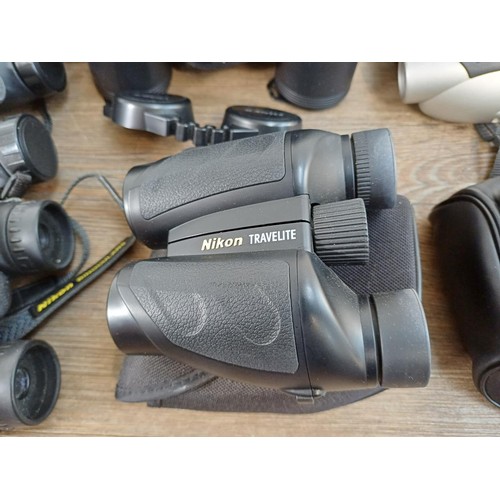 659 - Seven pairs of Nikon binoculars to include Action 8x40, Aculon A30 10x25, Eagleview 8-24x25 zoom, Tr... 