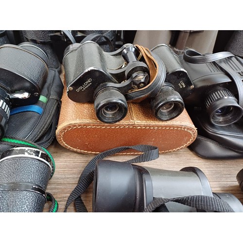 661 - A collection of binoculars to include Pentasonic, Commodore 10x50, Chinon 7-15x35 zoom, Dollond Luma... 