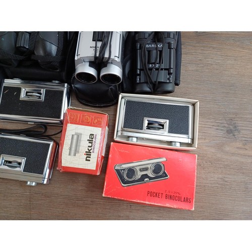 662 - A collection of pocket binoculars to include Tasco 10x25, Vivitar 10x25, Barska 8x21, Sunagor 9-45x2... 