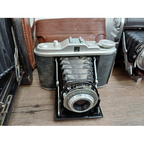 664 - Eleven folding cameras to include Zeiss Ikon Nettar 518/16, Coronet Rapide, Balda Baldix, Agfa Isole... 