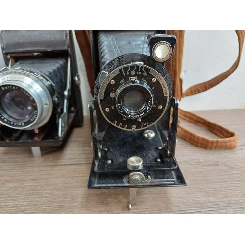 664 - Eleven folding cameras to include Zeiss Ikon Nettar 518/16, Coronet Rapide, Balda Baldix, Agfa Isole... 