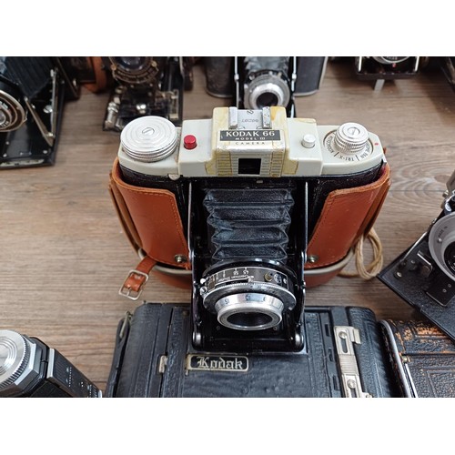 664 - Eleven folding cameras to include Zeiss Ikon Nettar 518/16, Coronet Rapide, Balda Baldix, Agfa Isole... 