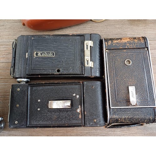 664 - Eleven folding cameras to include Zeiss Ikon Nettar 518/16, Coronet Rapide, Balda Baldix, Agfa Isole... 