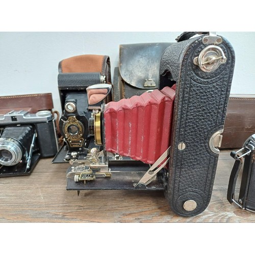 666 - Eight folding cameras to include Voigtländer Bessa I 6x9 viewfinder for 120 film, Agfa Isolette V, K... 