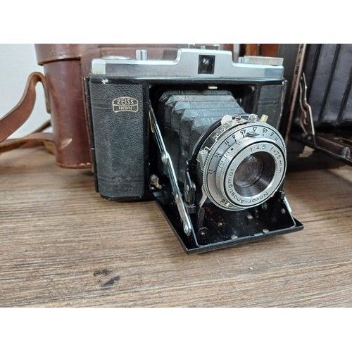 666 - Eight folding cameras to include Voigtländer Bessa I 6x9 viewfinder for 120 film, Agfa Isolette V, K... 