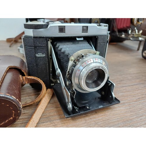 666 - Eight folding cameras to include Voigtländer Bessa I 6x9 viewfinder for 120 film, Agfa Isolette V, K... 