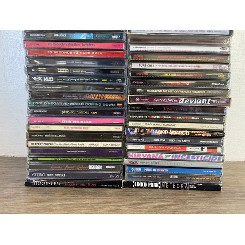 740 - Seventy-five CDs by a variety of rock artists and bands to include Incubus, Cream, Nirvana, 30 Secon... 