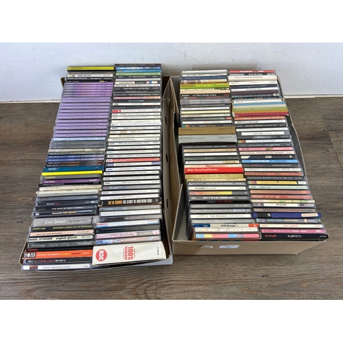 741 - Two boxes containing CDs by a variety of artists and bands to include The Prodigy, Oasis, Blur, R.E.... 