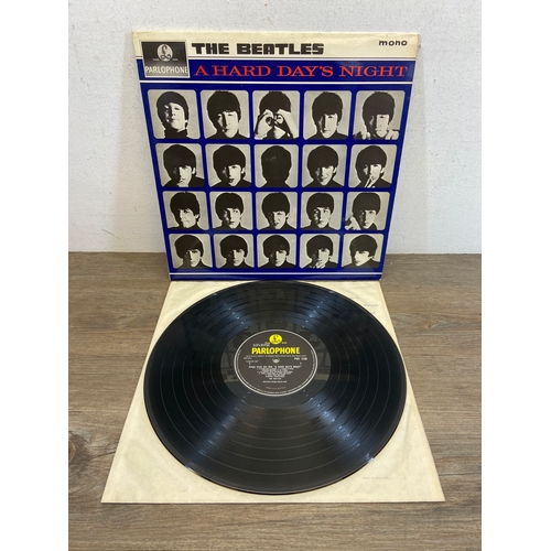 744 - An LP storage case containing a quantity of vinyl records, to include The Beatles 'A Hard Day's Nigh... 